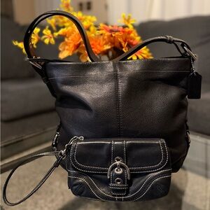 Coach hobo bag C1076-F15064 black leather bag with adjustable strap.